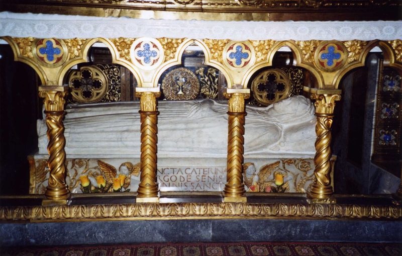The tomb of St. Catherine of Siena beneath the high altar of Santa Maria sopra Minerva, Rome, behind a gilded grille.