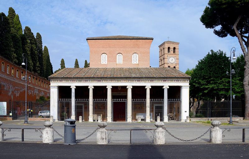 The Basilica of San Lorenzo fuori le Mura, Rome: a simple portico of columns beneath a medieval bell tower.
