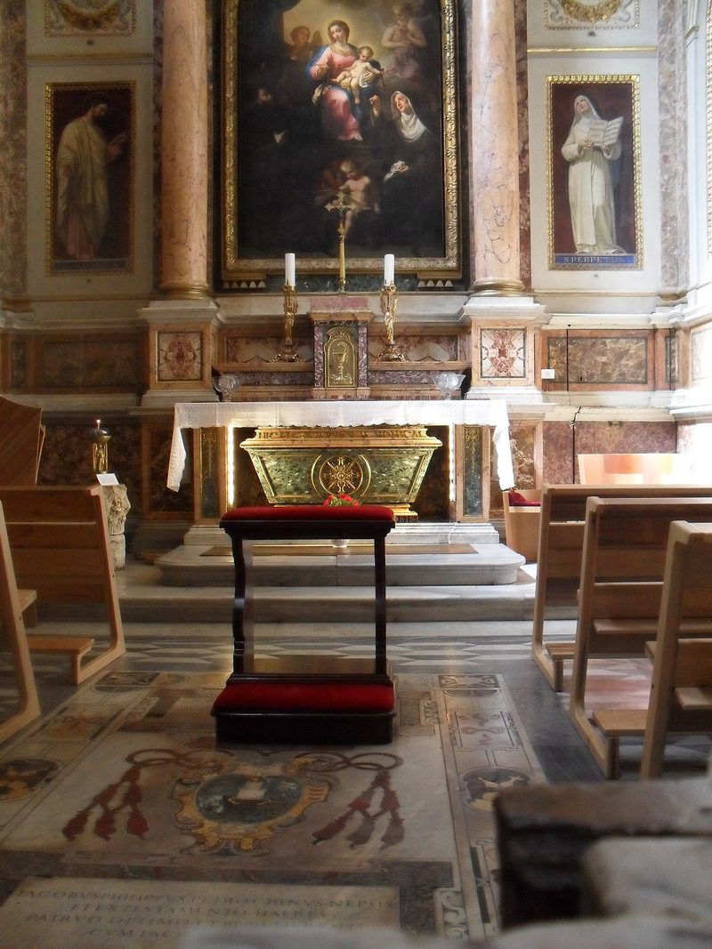 The chapel of St. Monica in the church of Sant’Agostino, Rome: a marble altar beneath a painting, with her tomb below.
