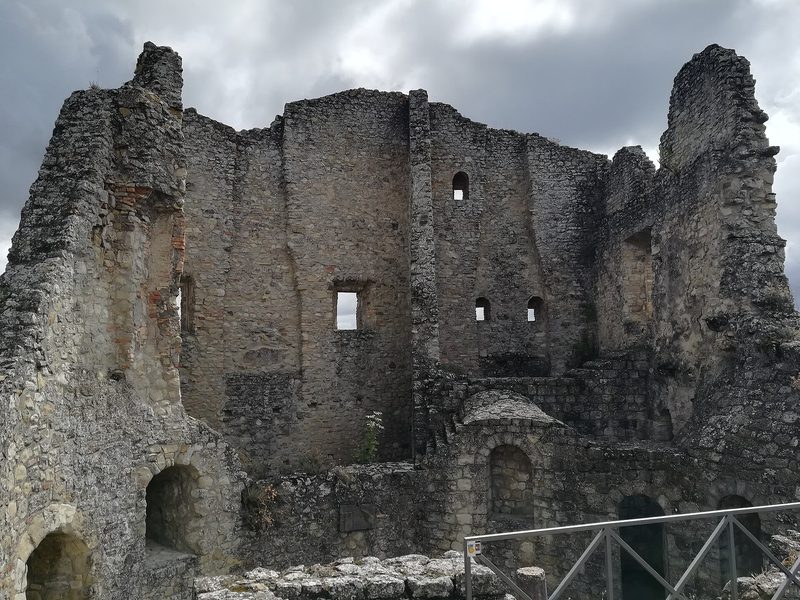 The ruined stone walls of the castle of Canossa in the Apennines.