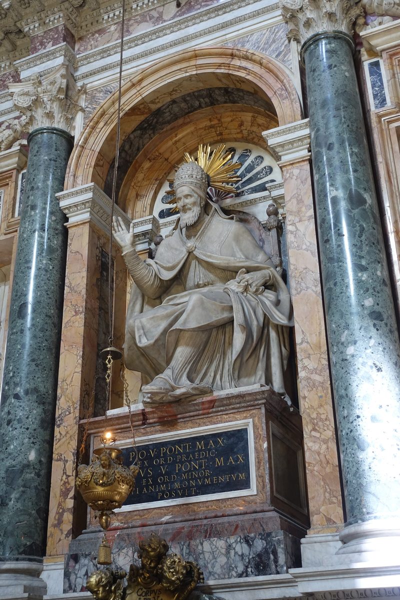 The marble monument of Pope St. Pius V in the Sistine Chapel of Santa Maria Maggiore, Rome: a seated statue of the pope blessing.