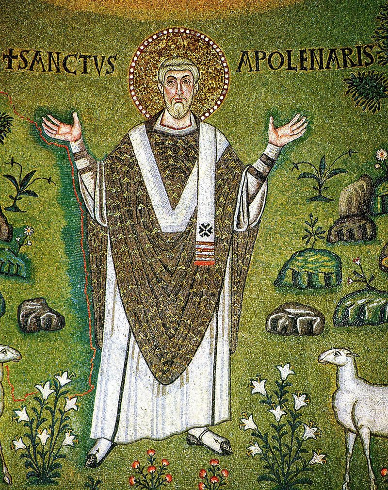 Mosaic of St. Apollinaris with arms raised in prayer, among plants and sheep.