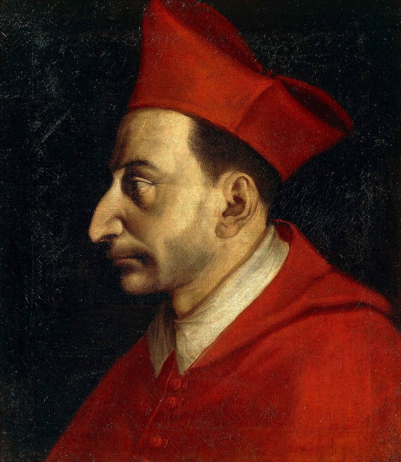 Portrait of St. Charles Borromeo in profile, in a cardinal’s red biretta.