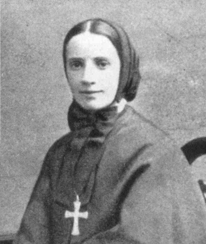 Black-and-white photograph of St. Frances Cabrini in a dark veil, a cross on her chest.