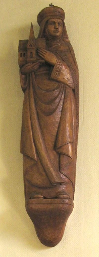 Wooden statue of St. Hedwig, crowned, holding a small church.