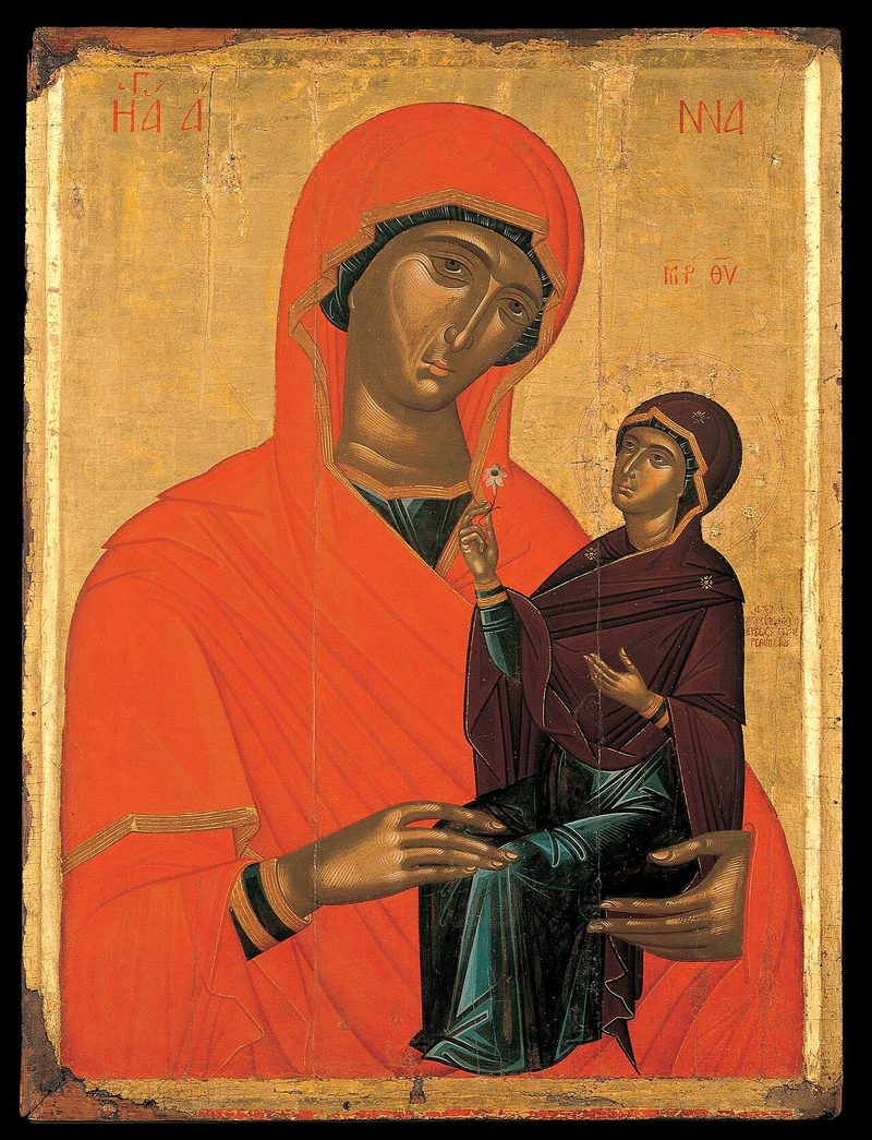 Icon of St. Anne in a red veil holding the child Mary.