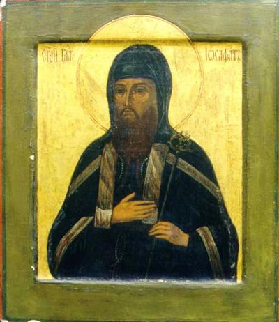 Icon of St. Josaphat in a dark monk’s hood and robe on a gold background.