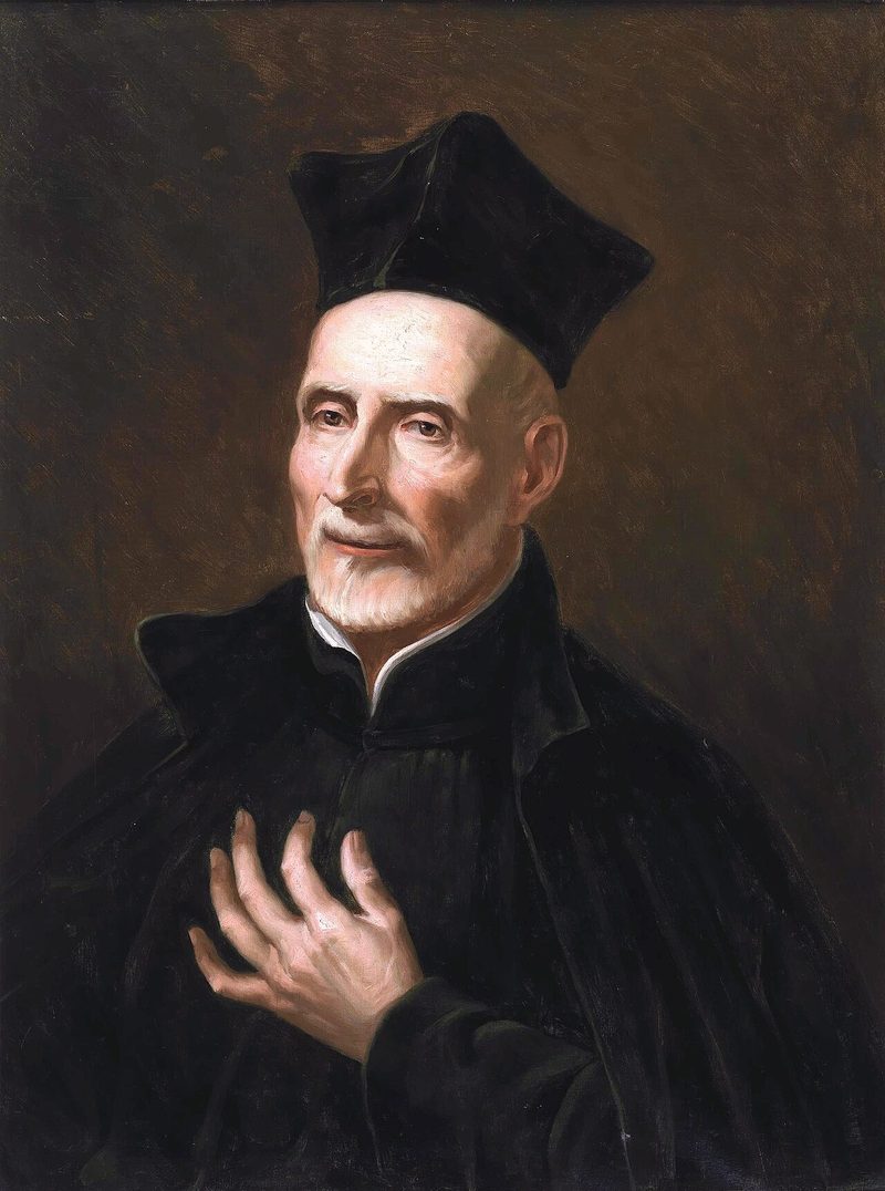 Portrait of St. Joseph Calasanz, an old priest in a black biretta, hand on his chest.