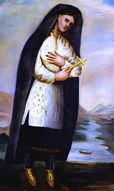 Painting of St. Kateri Tekakwitha in a dark shawl, holding a cross, beside a river.