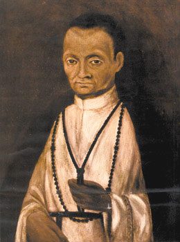 Painting of St. Martin de Porres in a white Dominican habit with a rosary.