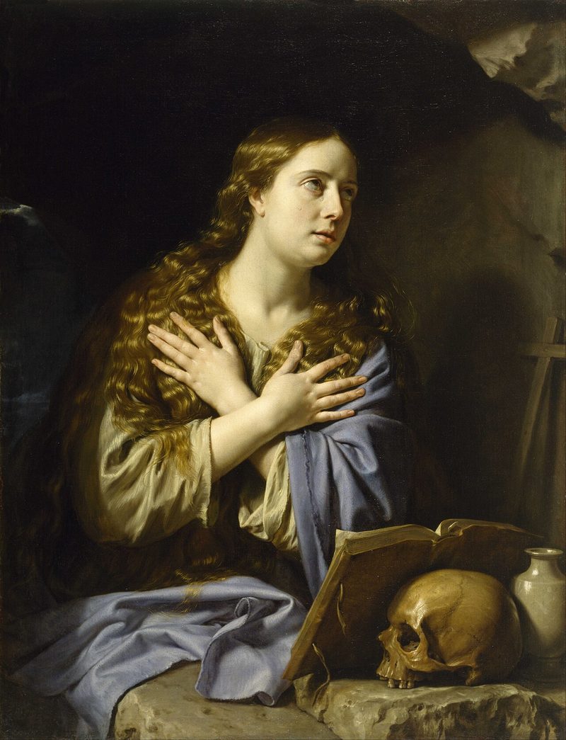 Painting of St. Mary Magdalene, hands crossed on her chest and eyes raised, beside a skull and a jar.