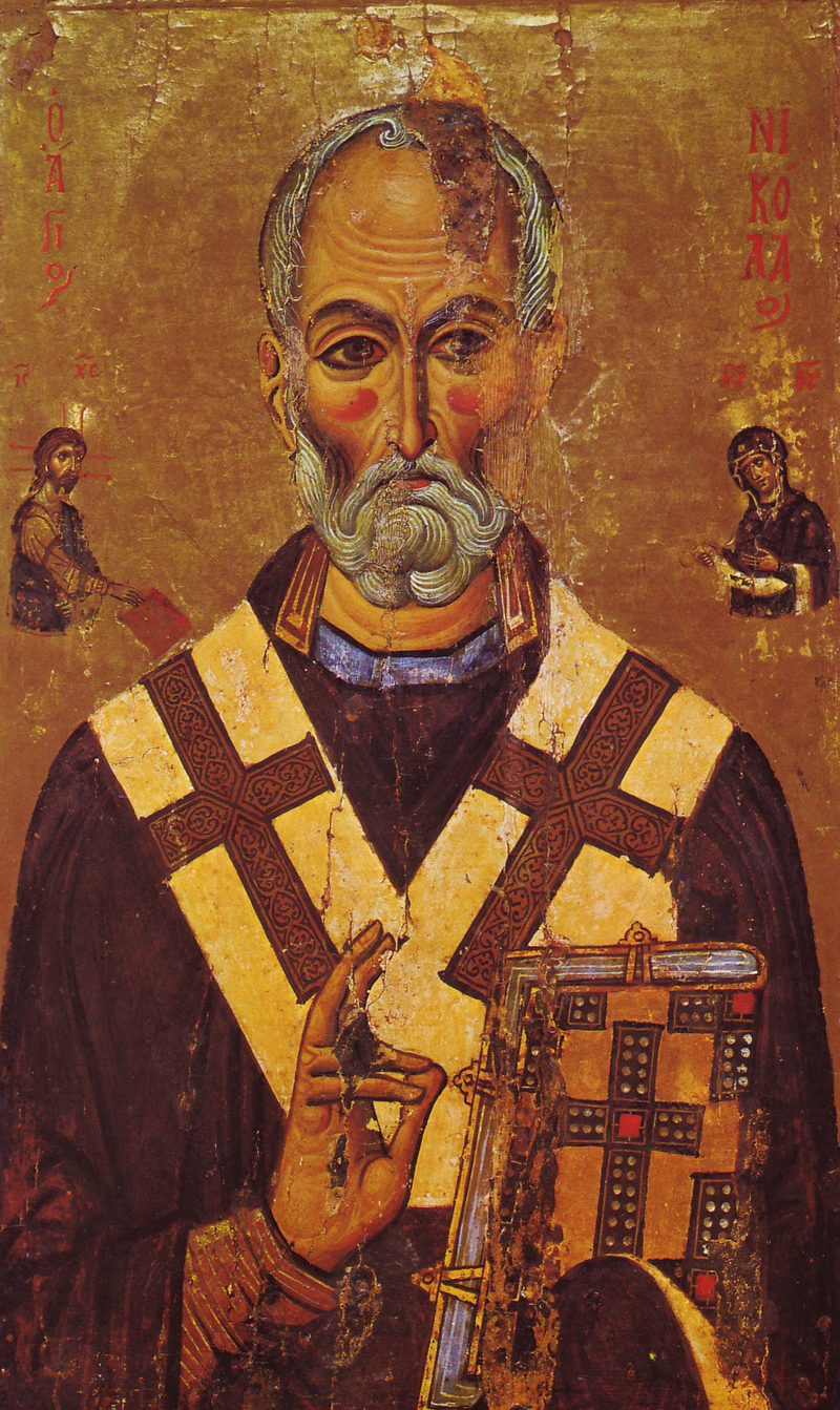Icon of St. Nicholas in bishop’s vestments, blessing and holding a Gospel book.