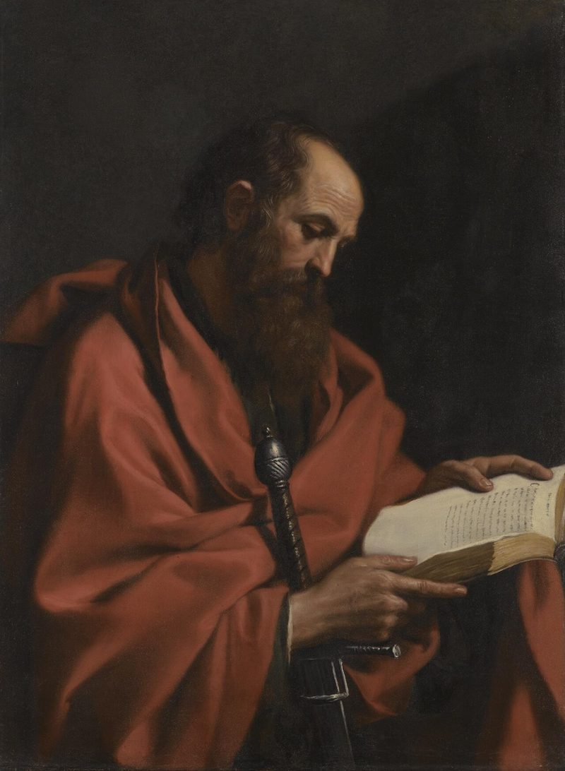 Painting of St. Paul in a red cloak, reading a book and holding a sword.