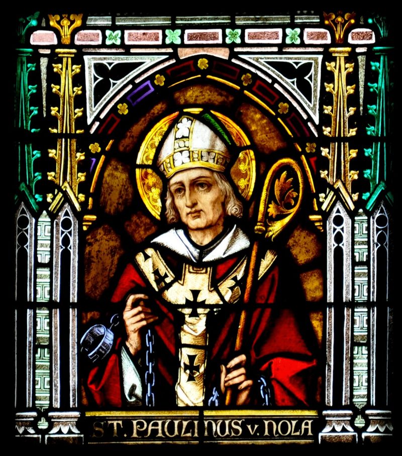 Stained-glass window of St. Paulinus of Nola as a bishop in a miter.