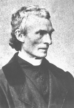 Black-and-white photograph of St. Peter Julian Eymard, gray-haired, in a priest’s cassock.