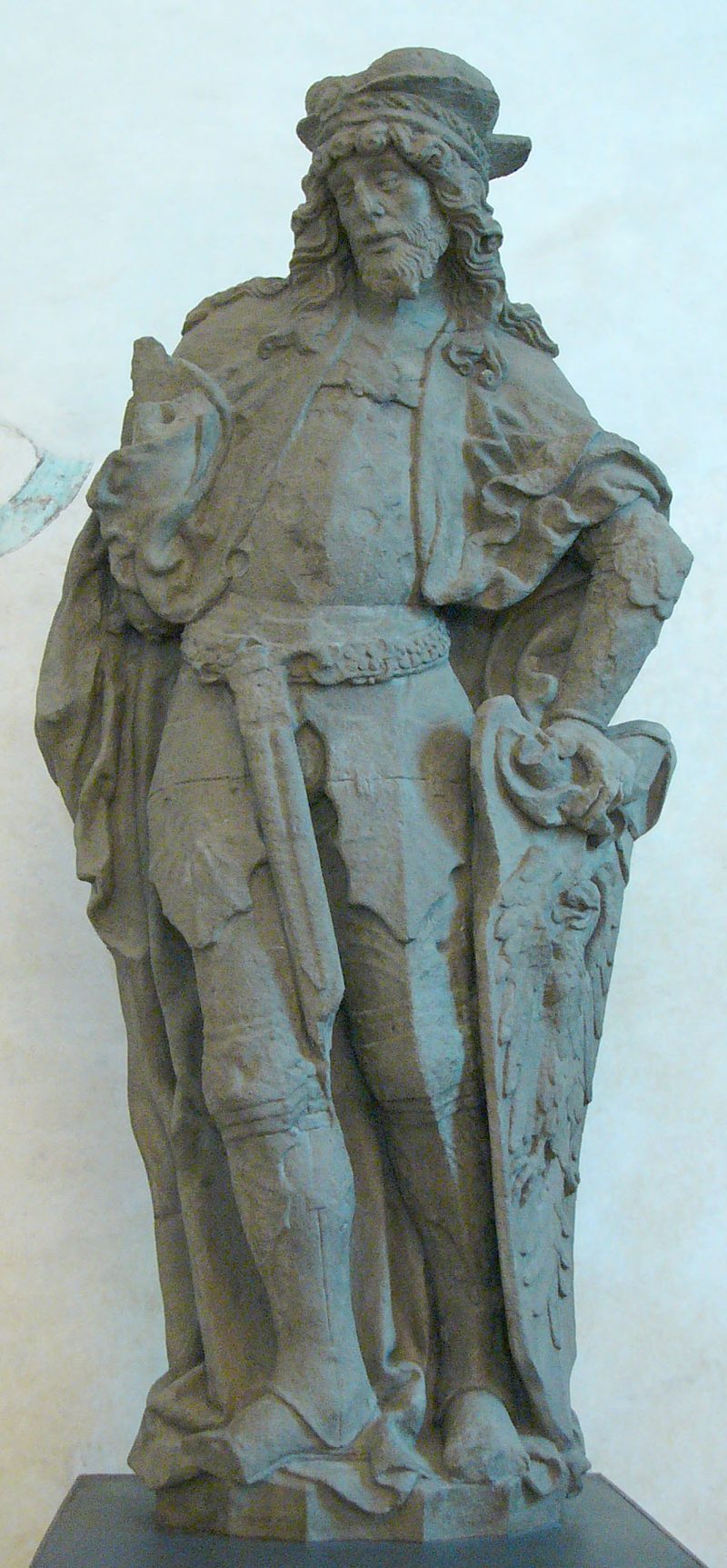 Stone statue of St. Wenceslaus standing in armor, in Olomouc.